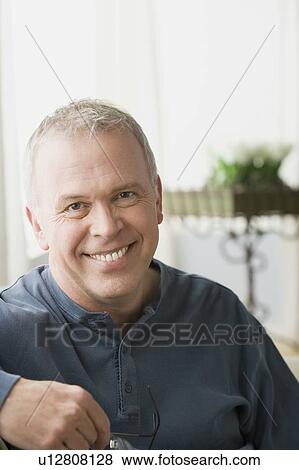 Portrait of smiling mature man View Large Photo Image Stock Photo - Portrait of smiling mature man. Fotosearch