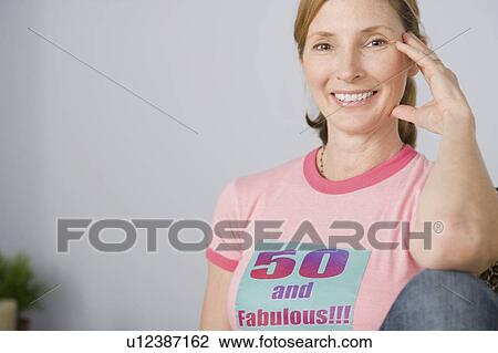 Portrait of smiling mature woman View Large Photo Image Stock Image - Portrait of smiling mature woman. Fotosearch