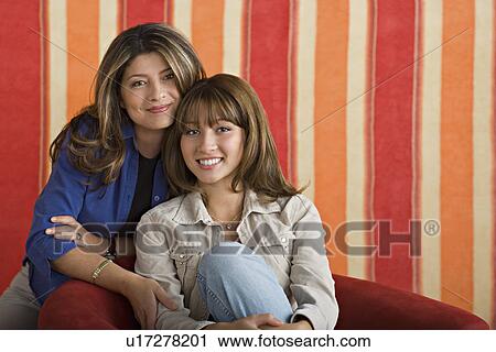 Stock Image - Portrait of smiling mother and daughter. Fotosearch