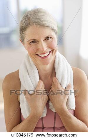 Portrait of smiling senior woman in gym View Large Photo Image Stock Photo - Portrait of smiling senior woman in gym. Fotosearch