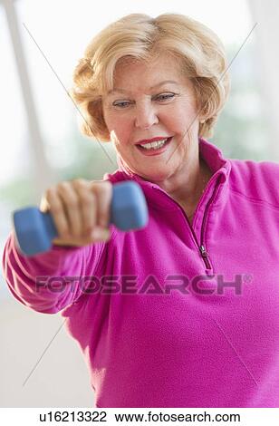Portrait of smiling senior woman training View Large Photo Image Stock Image - Portrait of smiling senior woman training. Fotosearch