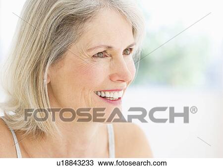 Stock Image - Portrait of smiling senior woman. Fotosearch