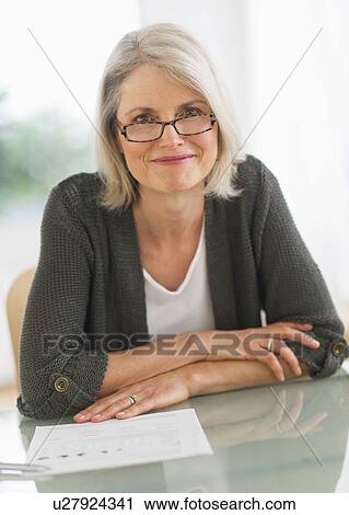 Stock Image - Portrait of smiling senior woman. Fotosearch