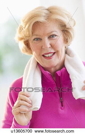 Portrait of smiling senior woman with towel View Large Photo Image Stock Image - Portrait of smiling senior woman with towel. Fotosearch