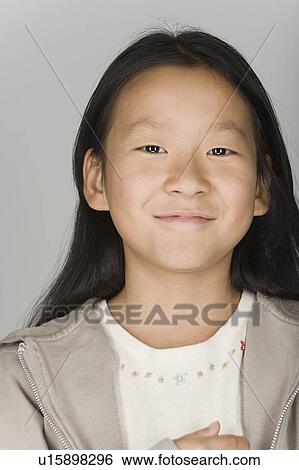 Stock Photograph - Portrait of smiling teenage girl. Fotosearch