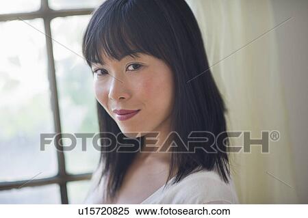 Portrait of smiling woman looking at camera View Large Photo Image Stock Photography - Portrait of smiling woman looking at camera. Fotosearch
