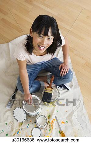 Portrait of smiling woman mixing paint View Large Photo Image Stock Photograph - Portrait of smiling woman mixing paint. Fotosearch