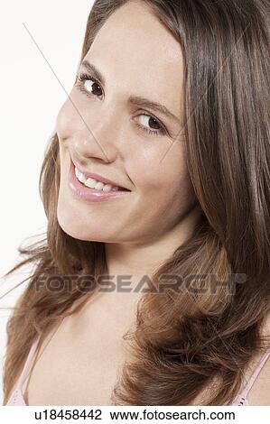 Portrait of smiling woman, studio shot View Large Photo Image Stock Image - Portrait of smiling woman, studio shot. Fotosearch