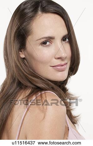 Portrait of smiling woman, studio shot View Large Photo Image Stock Photo - Portrait of smiling woman, studio shot. Fotosearch