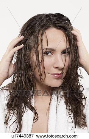 Portrait of smiling woman with wet hair, studio shot View Large Photo Image Stock Photo - Portrait of smiling woman with wet hair, studio shot. Fotosearch