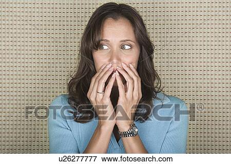 Stock Photo - Portrait of surprised woman. Fotosearch