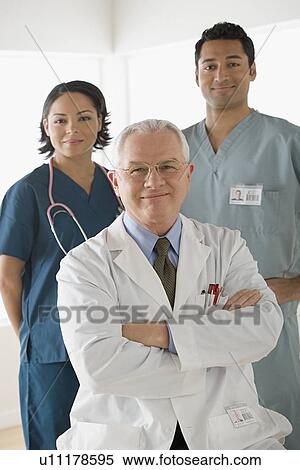 Portrait of three doctors View Large Photo Image Stock Photography - Portrait of three doctors. Fotosearch