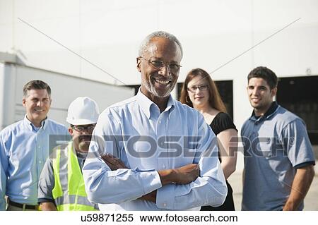 Portrait of warehouse workers and manager View Large Photo Image Stock Photography - Portrait of warehouse workers and manager. Fotosearch