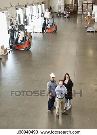 Portrait of warehouse workers View Large Photo Image Stock Image - Portrait of warehouse workers. Fotosearch