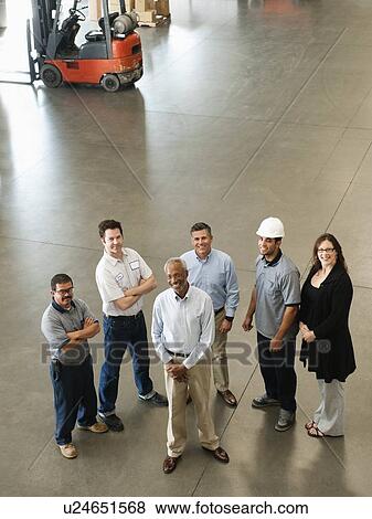 Portrait of warehouse workers View Large Photo Image Stock Photo - Portrait of warehouse workers. Fotosearch