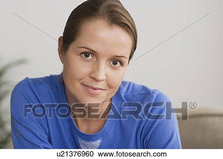 Portrait of woman in blue blouse View Large Photo Image Stock Image - Portrait of woman in blue blouse. Fotosearch