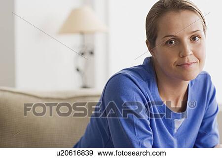 Stock Photo - Portrait of woman in blue blouse. Fotosearch