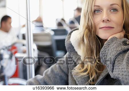 Portrait of woman in subway train View Large Photo Image Stock Photograph - Portrait of woman in subway train. Fotosearch