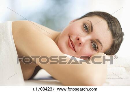 Stock Photo - Portrait of woman relaxing in spa. Fotosearch