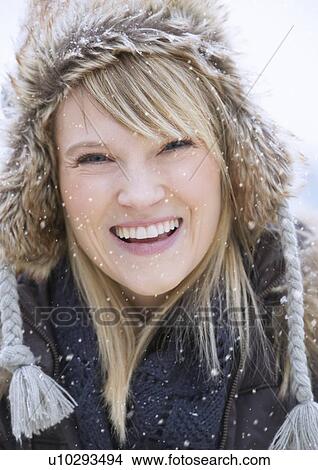 Portrait of woman wearing knit hat laughing View Large Photo Image Picture - Portrait of woman wearing knit hat laughing. Fotosearch