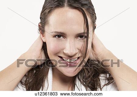 Portrait of woman with long wet hair, studio shot View Large Photo Image Stock Image - Portrait of woman with long wet hair, studio shot. Fotosearch