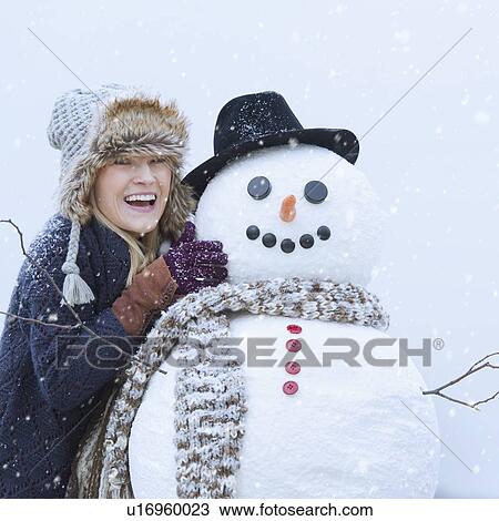Portrait of woman with snowman View Large Photo Image Stock Image - Portrait of woman with snowman. Fotosearch