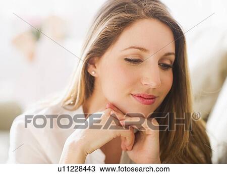 Stock Image - Portrait of young woman . Fotosearch