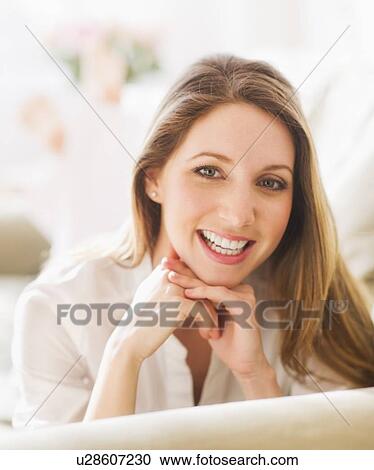 Stock Image - Portrait of young woman . Fotosearch