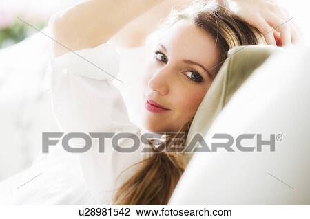 Stock Image - Portrait of young woman . Fotosearch