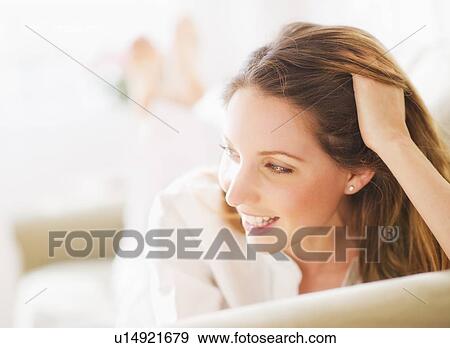 Stock Photo - Portrait of young woman . Fotosearch