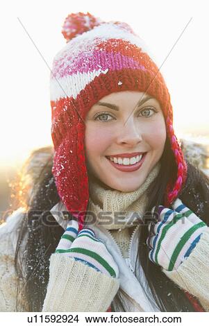 Picture - Portrait of young woman wearing knit hat. Fotosearch
