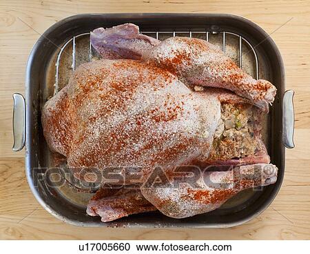 Raw turkey on roasting pan View Large Photo Image Stock Image - Raw turkey on roasting pan. Fotosearch