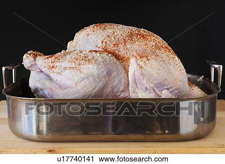 Raw turkey on roasting pan View Large Photo Image Stock Image - Raw turkey on roasting pan. Fotosearch