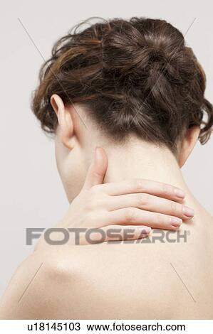 Rear view of beautiful young woman, studio shot View Large Photo Image Stock Image - Rear view of beautiful young woman, studio shot. Fotosearch