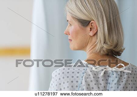 Rear view of senior female patient in hospital View Large Photo Image Stock Photo - Rear view of senior female patient in hospital. Fotosearch