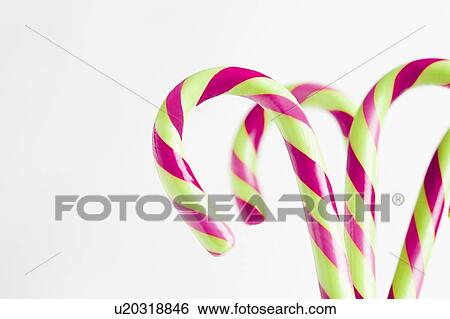 Stock Photograph - Red and white candy canes, studio shot. Fotosearch