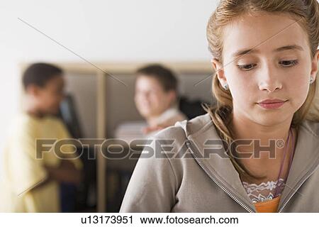 Schoolgirl daydreaming with two colleagues in background View Large Photo Image Stock Image - Schoolgirl daydreaming with two colleagues in background. Fotosearch