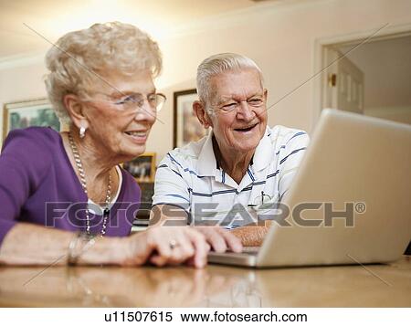 Senior couple using laptop View Large Photo Image Stock Photography - Senior couple using laptop. Fotosearch