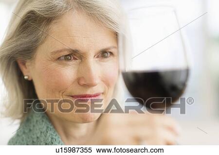 Senior female connoisseur tasting red wine View Large Photo Image Stock Photography - Senior female connoisseur tasting red wine. Fotosearch