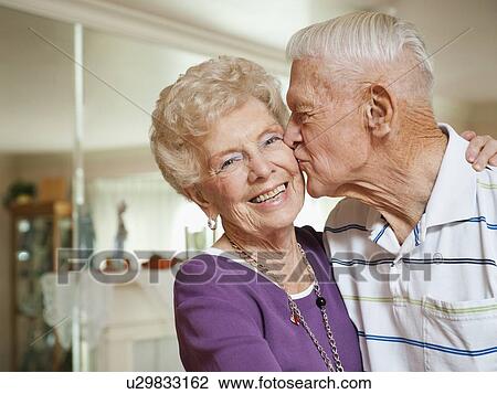 Senior man kissing woman View Large Photo Image Stock Image - Senior man kissing woman. Fotosearch
