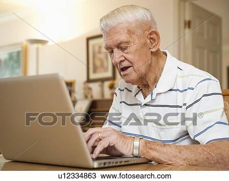 Senior man using laptop View Large Photo Image Stock Image - Senior man using laptop. Fotosearch