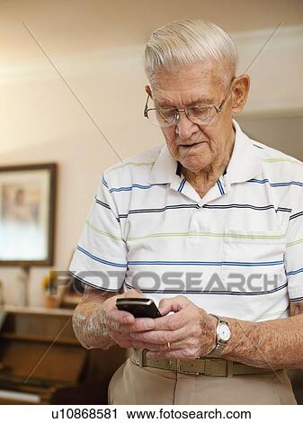 Stock Image - Senior man using phone. Fotosearch