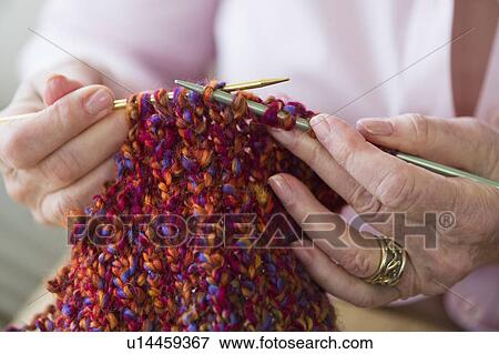 Senior woman knitting, close-up View Large Photo Image Stock Photo - Senior woman knitting, close-up. Fotosearch
