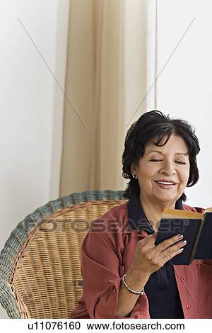 Senior woman reading book View Large Photo Image Stock Image - Senior woman reading book. Fotosearch