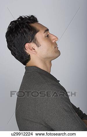 Side view of mid adult man with hands on hip, head and shoulders View Large Photo Image Picture - Side view of mid adult man with hands on hip, head and shoulders. Fotosearch