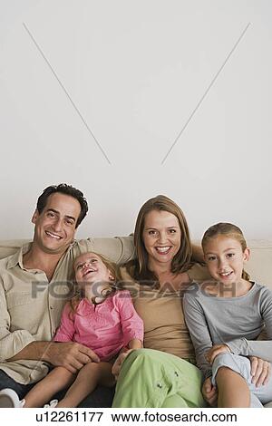 Smiling family with two daughters (8-9, 12-13) View Large Photo Image Stock Photo - Smiling family with two daughters (8-9, 12-13). Fotosearch