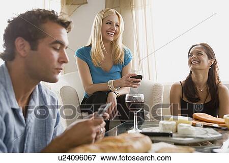 Smiling people at home party playing cards View Large Photo Image Stock Photo - Smiling people at home party playing cards. Fotosearch