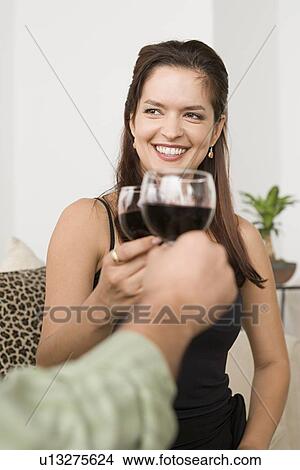 Smiling woman toasting View Large Photo Image Picture - Smiling woman toasting. Fotosearch