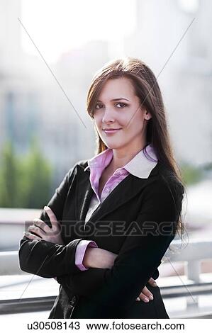Smiling young businesswoman View Large Photo Image Stock Image - Smiling young businesswoman. Fotosearch