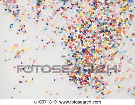 Stock Photo - Sprinkles on dessert. Fotosearch